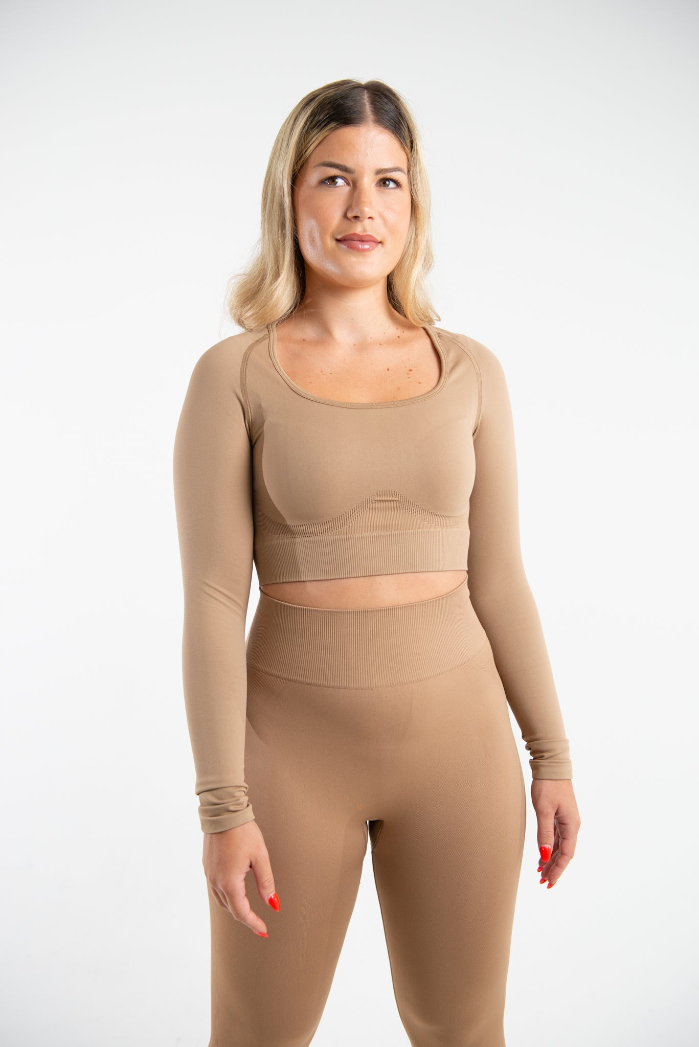 Image of Model wearing Hazelnut Seamless Long Sleeve Top with matching colour Leggings posing front face.