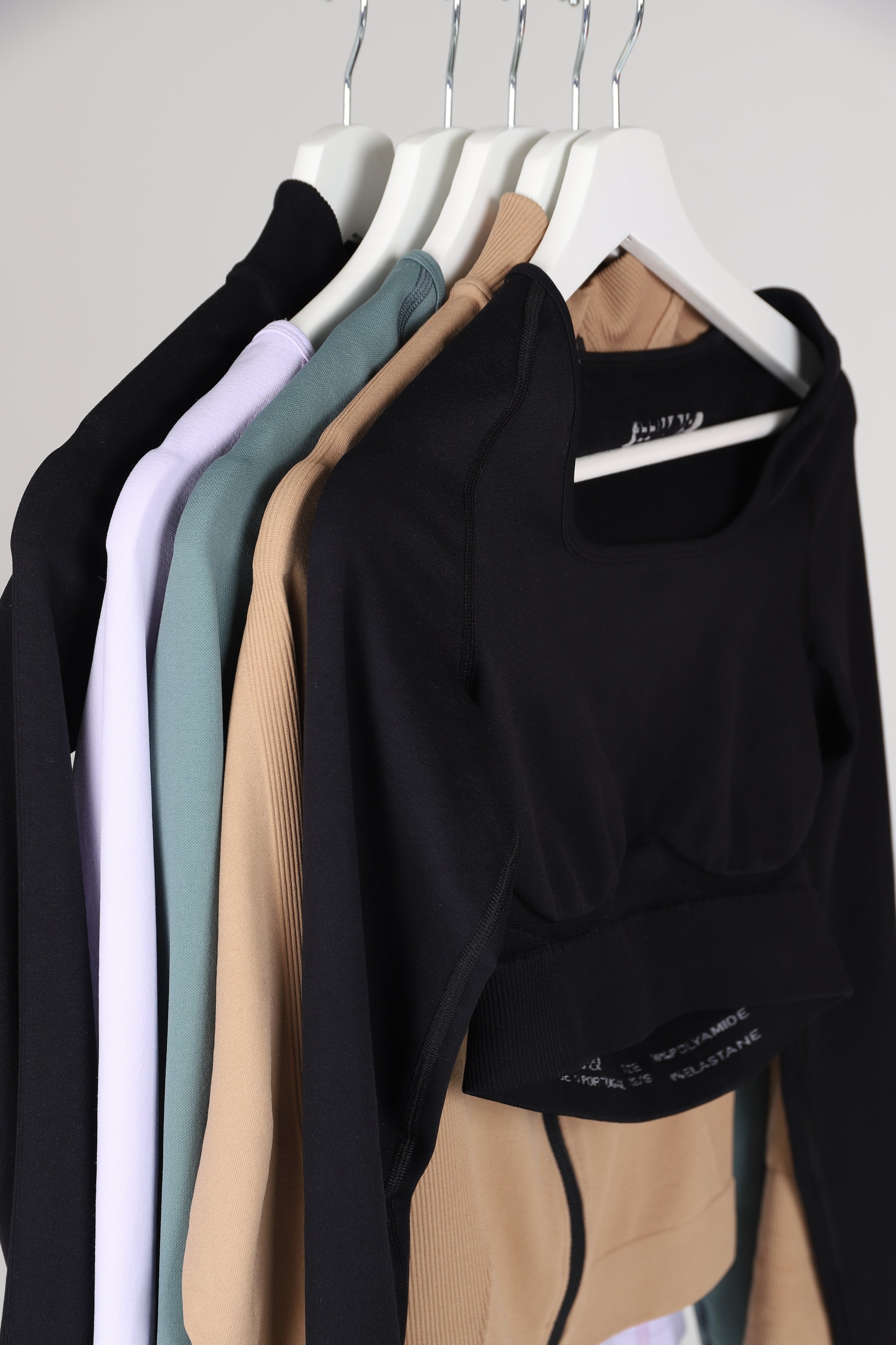 Image of multi-colour seamless long sleeve tops.