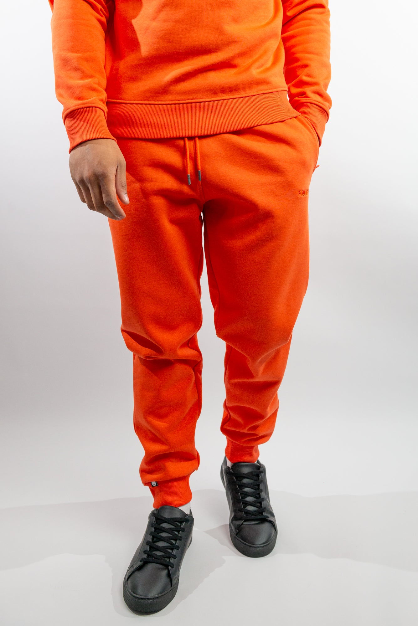 Mandarin Red Joggers made with organic cotton and recycled materials