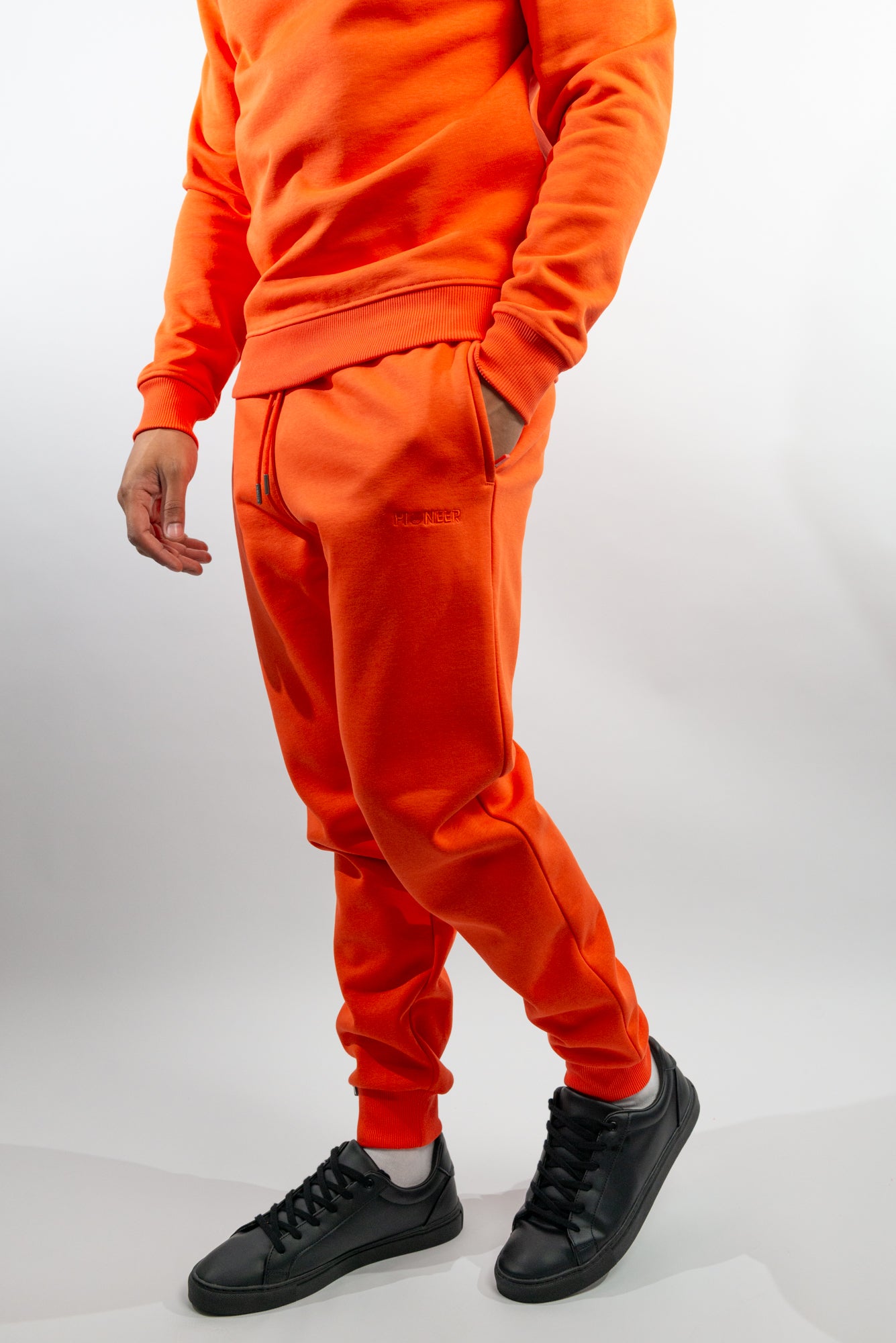 Mandarin Red Joggers made with organic cotton and recycled materials