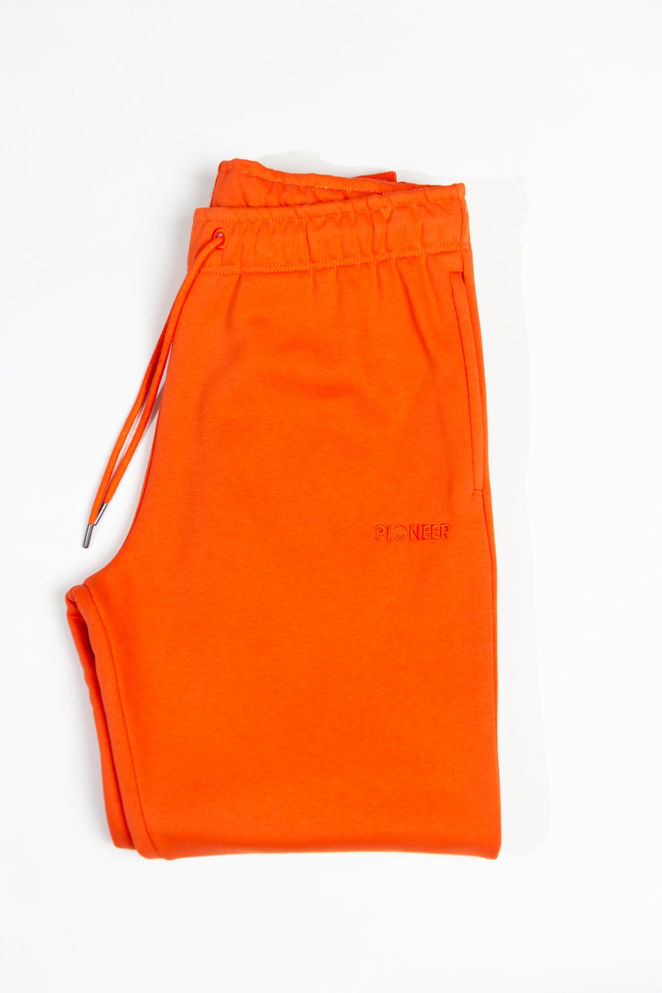 Mandarin Red Joggers made with organic cotton and recycled materials