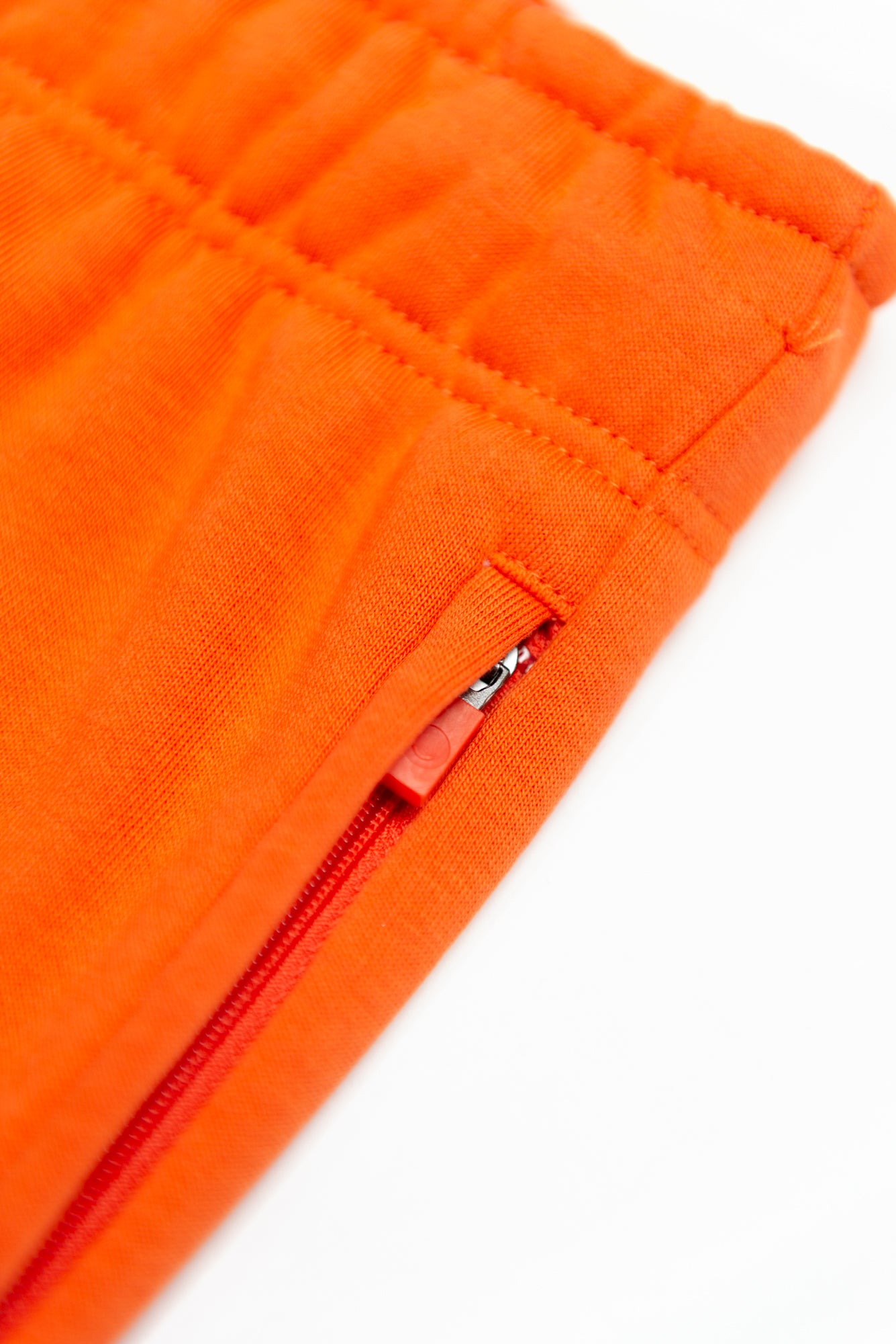 Mandarin Red Joggers made with organic cotton and recycled materials